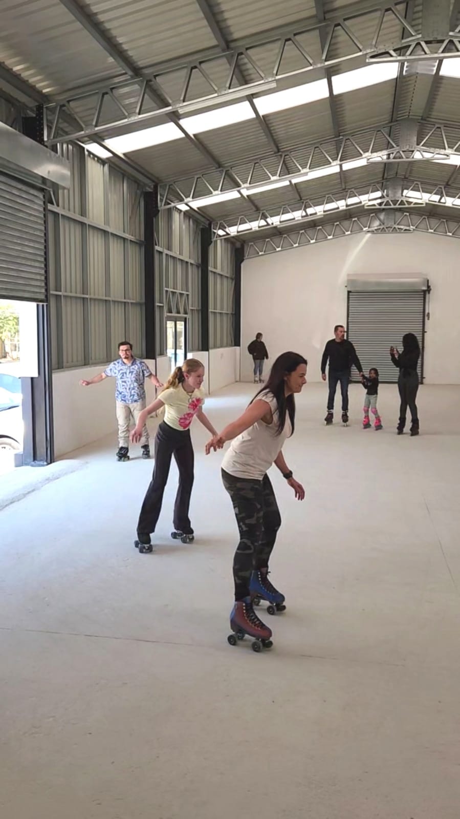 Skaters rolling together at Da Rolly Skating Rink