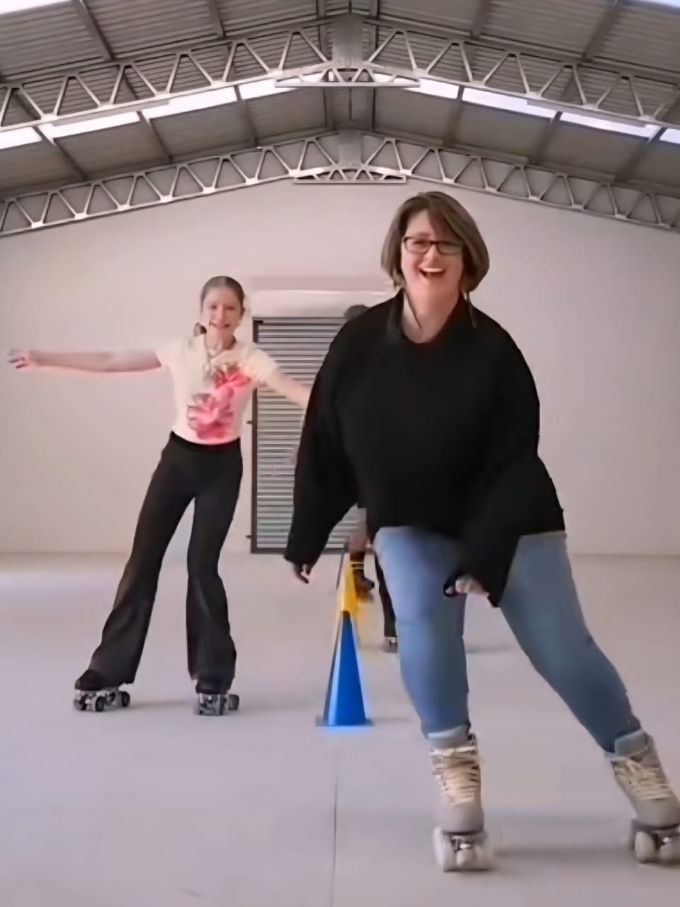 Two skaters having fun on the rink